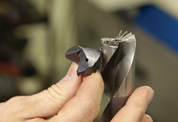 Replaceable carbide drill heads range extended