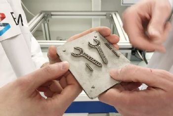 3-D printing a metal tool in zero gravity