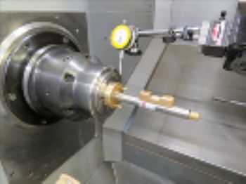 Laser alignment device for bar feeders