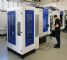 Five-axis machining cell features robotic workpiece magazine